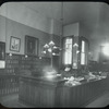 George Bruce Interior Views: Miss Griffith at desk, Circulation room