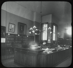 George Bruce Interior Views: Miss Griffith at desk, Circulation room