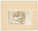Men around book cart