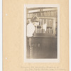 Immigrant boy inspecting treasures of New York Public Library Loan collection, Ellis Island Hospital Library