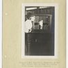 Immigrant boy inspecting treasures of New York Public Library Loan collection, Ellis Island Hospital Library