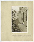 Boy reading on doorway.  "'The Family Entrance'" - Williamsbridge Sub-Branch, New York Public Library