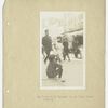 Boy sitting on curb reading.  "One of the 'Easy Book' Readers. 	Rivington Street."