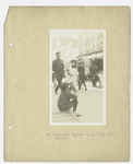 Boy sitting on curb reading.  "One of the 'Easy Book' Readers. 	Rivington Street."