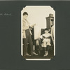 Man and boy with books at Ellis Island library