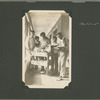 Men at Ellis Island with library book cart