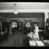 Columbia University, librarian and readers at desks, Traveling Library Station at Columbia University