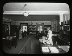 Columbia University, librarian and readers at desks, Traveling Library Station at Columbia University