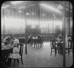 Children on Columbus roof, shaded by awning