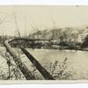 A Swinging Pipe Line over a Stream.