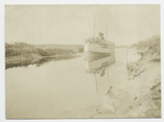 Steamer moving along waterway (Cape Cod Canal?)