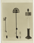 Model of Liverpool and Manchester railway day and night signals. Represents the earliest form of fixed signal, introduced on the Liverpool and Manchester RR about 1834. It consists of a rectangular frame on which a red flag was stretched, fixed to a verticle rod that was mounted in bearings attached to a wooden post. By means of a handle near the bottom the flag could be turned so as to face the engine driver, when indicating danger or set parallel with the rails for safety. Red and white lights placed on posts serve the same purpose at night.
