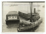 Gathering supplies, especially large quantities of gasoline, at Staten Island from which point they are being shipped to the Allies.