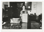 Pauline Bauer of city P.O. illustrating packing correctly.