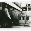 Harbor boat service, New York. Canvas chute used to transfer mail. Note bag.