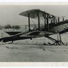 Air mail plane equipped with snow shoes.