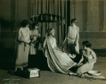 Ruth St Denis and company in scene from the Greek section of the Greek pageant, with painted backdrop used in vaudeville tour