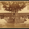 Ladies standing at the front of a building.