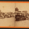 People sitting in chairs on the beach, Old Orchard Beach, Maine.