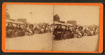 People sitting in chairs on the beach, Old Orchard Beach, Maine.