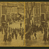 View of parade of men on horses and a marching band.
