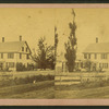 View of a house behind the fence.