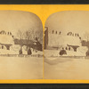 A winter view in Eastport showing people waving from the top of a snow-covered building.
