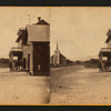 View of a road, church and three men standing on in front of a building, California.