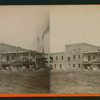 Men lifting hay into a 2-story shed, Stockton, California.