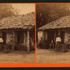 Four men in front of a house