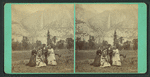 Group of tourists, with Yosemite Falls as backdrop.
