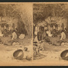 A group of Mohaves in a brush hut, one man very emaciated