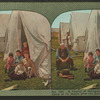 A family of refugees waiting for dinner in camp at Ft. Mason after the San Francisco disaster.