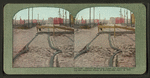Mission Street car track and pavement showing the resistless power of earthquakes, April 18, 1906.