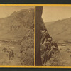 A ranch from a high rocky vantage.