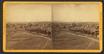 General view of East Denver and distant view of Rocky Mountains.