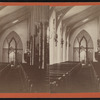 View of a garland-draped church interior.