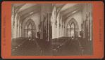 View of a garland-draped church interior.