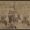 Men in street looking at scene of fire and ice on trees