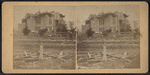 View of a damaged house with collapsed roof.