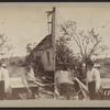 View of residents surveying the damage.