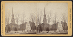 A frozen fountain in the square, with a church and other buildings visible beyond in New Britain.