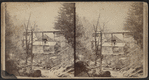 Abram F. Palmer's shop in the pines below, south of Cornwall Plain or Pine Street, Andrew K. Palmer, s[t]anding on the back shop.