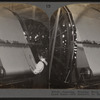 Beaming, winding warp from large reel on to loom beam. Silk industry, South Manchester, Conn., U.S.A.