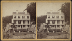 View of men working on the foundation of a house.