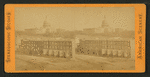 View of U.S. Capitol, with a row of homes in the foreground.
