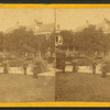 Men and women in a garden.