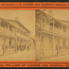 View of people in their balconies in a residential street.