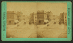iew on Washington Street [a commercial street with stores, street car and carts.]