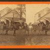 racker wagon.  [Man riding mule pulling cart with woman in it].